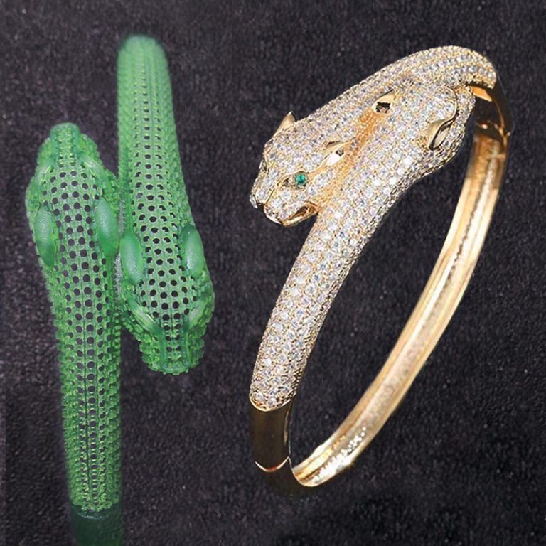 On the left, a green resin bracelet model with a hollow grid - like structure; on the right, a cast - made golden leopard - shaped bracelet of the same form, studded with diamonds and green gemstone eyes.