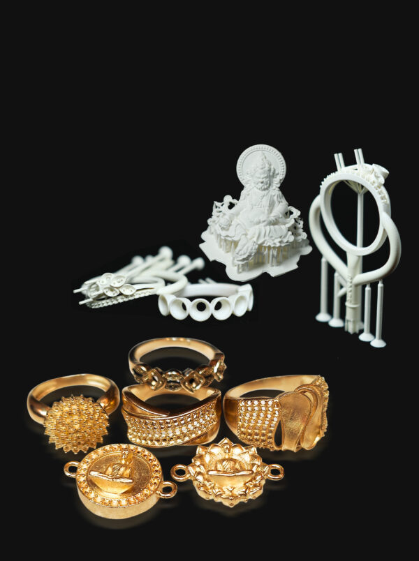 A collection of items including several exquisitely - designed gold jewelry pieces like rings and pendants at the bottom, and 3D - printed models made of white wax resin, such as a Buddha statue and structural components, at the top.