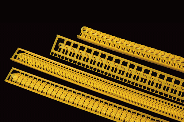 Yellow castable resin - made 3D printed bracelet prototypes for jewelry, featuring grid and notch structures