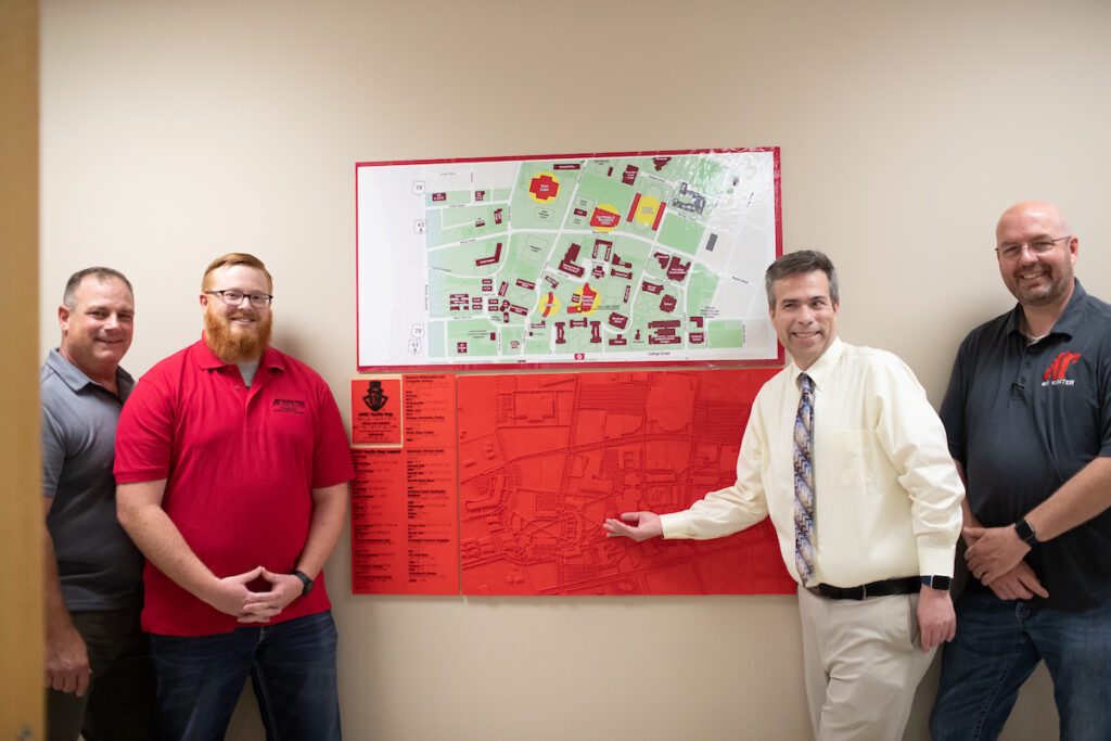 Team members behind the 3D-printed tactile campus map at Austin Peay’s GIS Center.