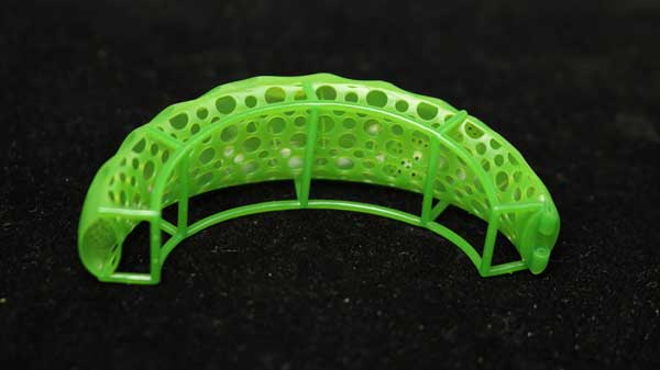 3D - printed green castable resin bracelet segment with split - style clasp interlock and hollow frame design