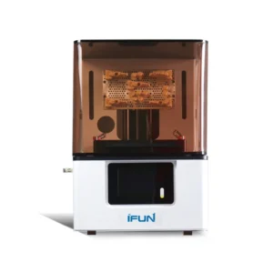 Front view of an iFUN dental resin 3D printer with a white base, touchscreen panel, and amber UV enclosure, showcasing printed golden dental models on the raised build plate.