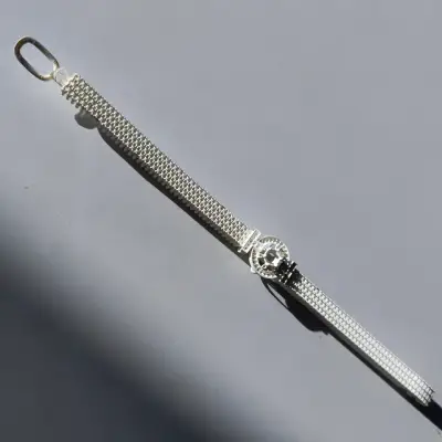 A high-detail 3D printed prototype of a pave-style bracelet strap, printed using IFUN T800 castable white wax resin.