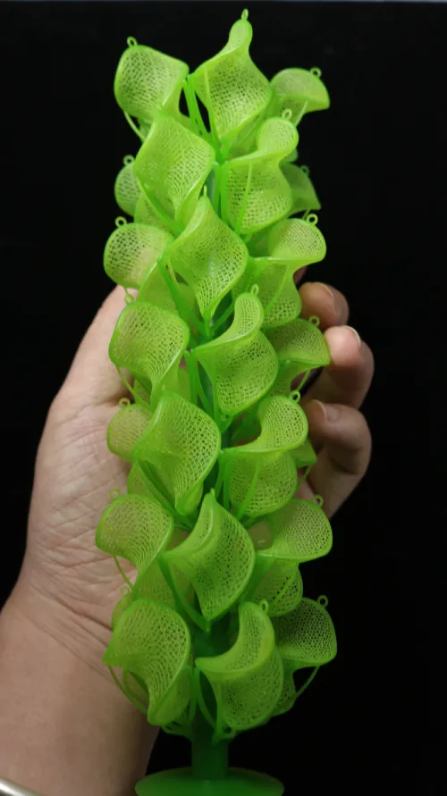 A 3D printed resin casting tree for jewelry with complex filigree designs.