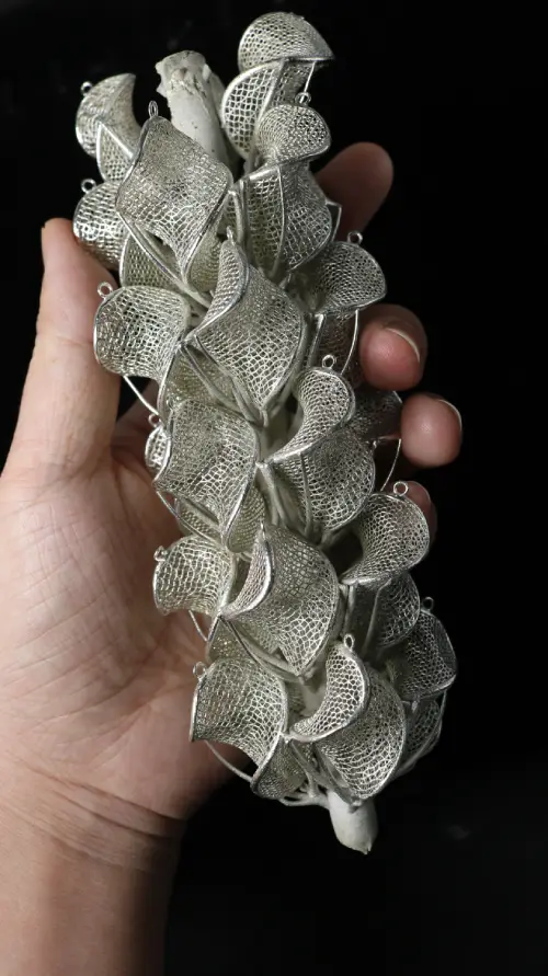 A cast silver jewelry tree showing a successful lost wax casting result.