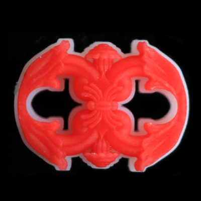 Symmetrical scrollwork and filigree jewelry component 3D printed in wax.