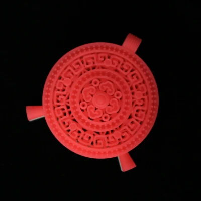 Top view of a red 3D printed wax jewelry pendant featuring intricate traditional Chinese geometric and ruyi cloud motifs, optimized for precision investment casting.