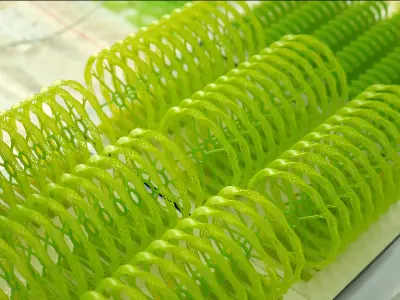 A batch of green resin jewelry bracelets vertically printed on the build plate using IFUN 700d castable resin, showcasing clean 0.30mm micro-gaps and zero residue after rinsing.