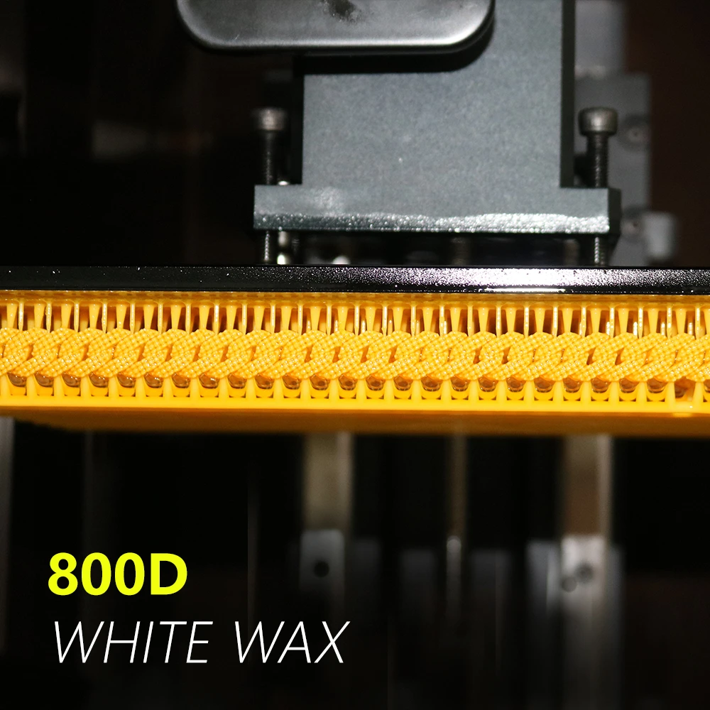 Front view of 3D printed Cuban link chain with stone setting holes attached to resin printer build plate