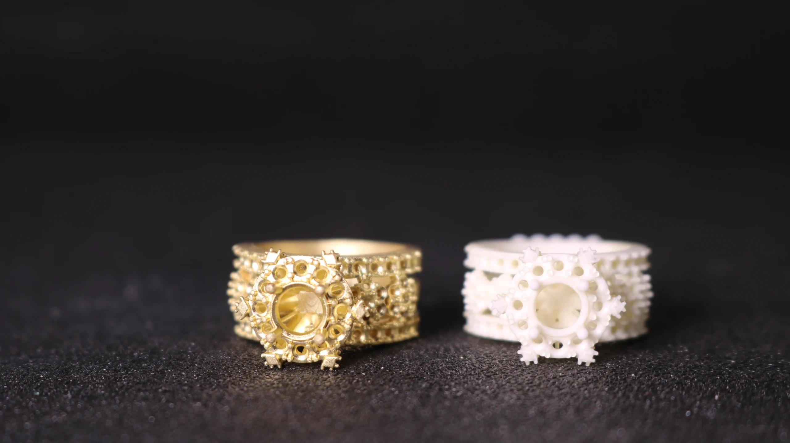 Front view comparison of lost-wax gold cast cluster pave ring and 800D white wax resin 3D printed pattern