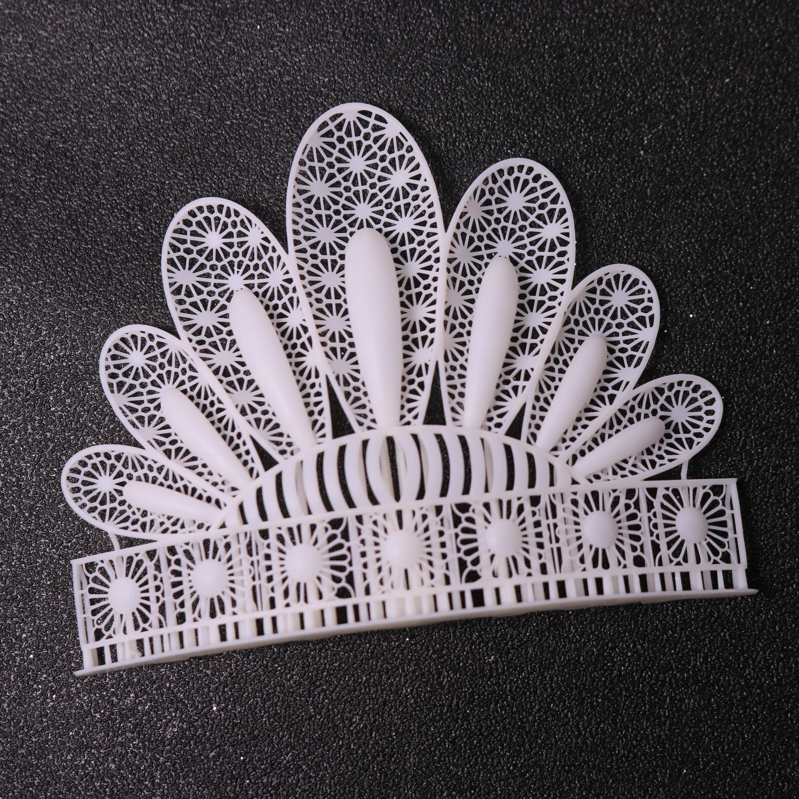 Top view flat lay of 3D printed radial fan filigree tiara hairpiece in 800D white wax resin