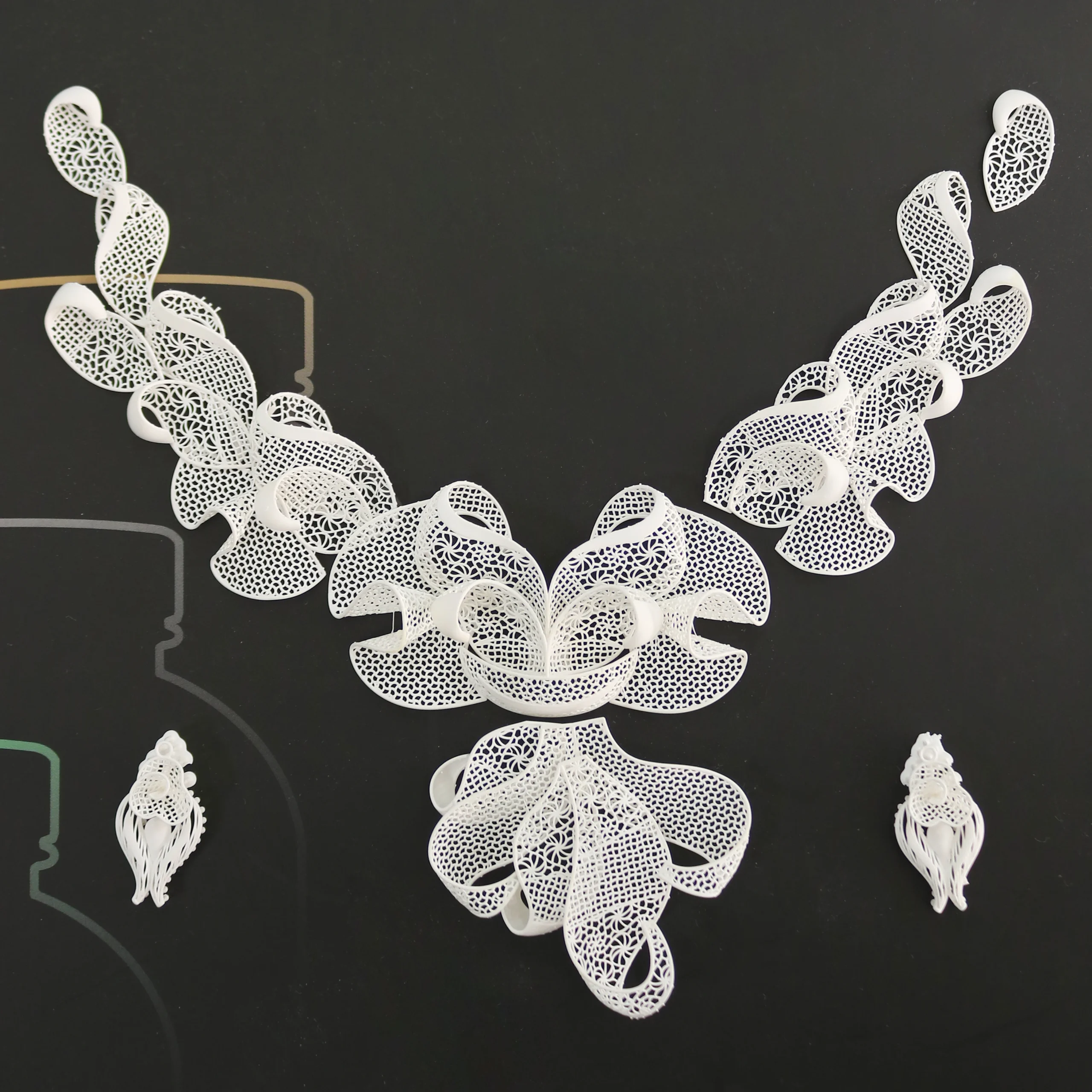 Top view of 3D printed filigree floral necklace set made with 800D white wax resin